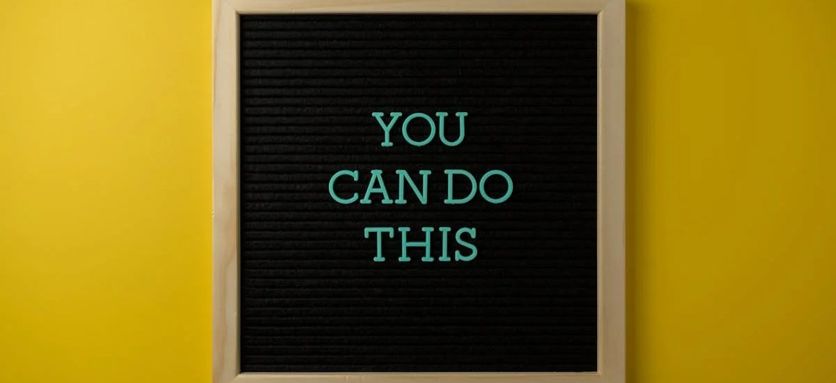 Inspirational message 'You Can Do This' displayed on a blackboard with a bold yellow backdrop.
