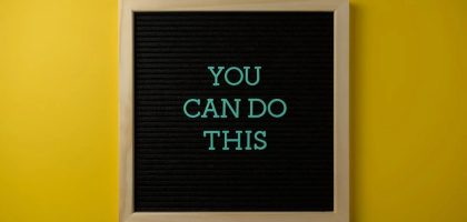 Inspirational message 'You Can Do This' displayed on a blackboard with a bold yellow backdrop.
